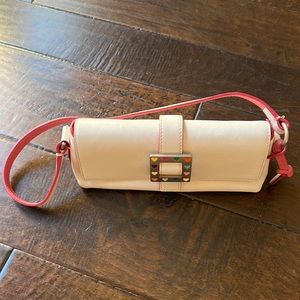 Dooney & Bourke white leather handbag with pink trim.